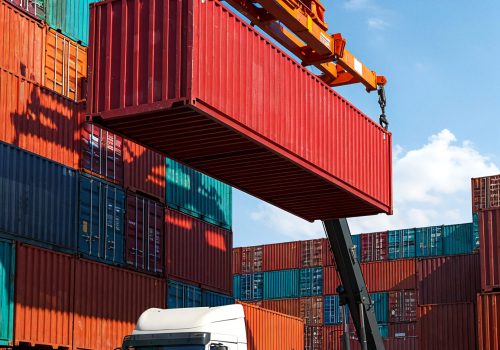 shipping-container-being-loaded-onto-truck-port